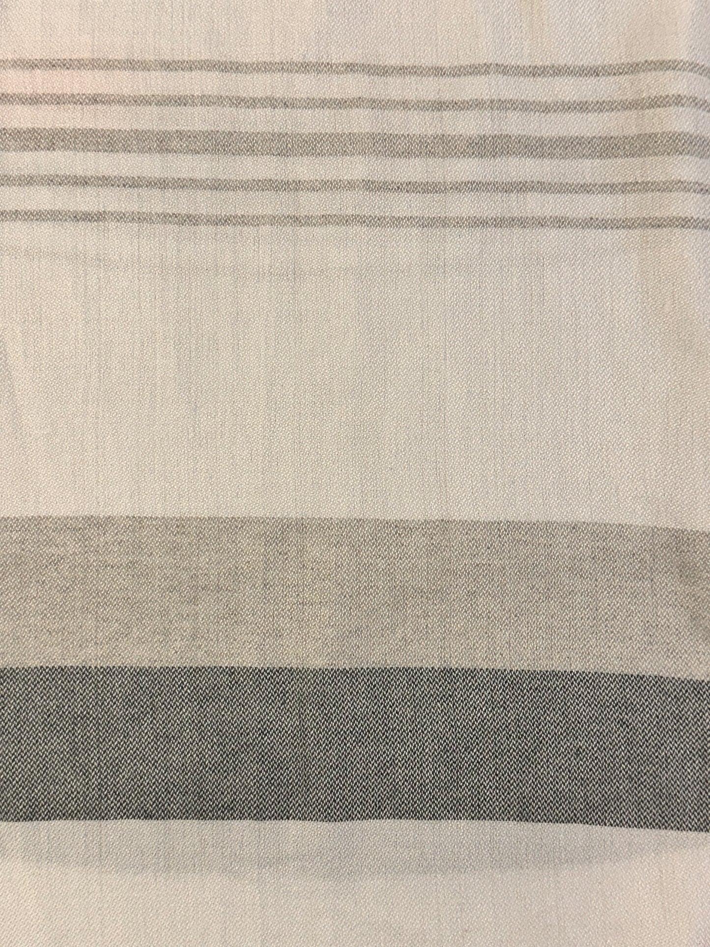 closeup of grey, charcoal and white fabric