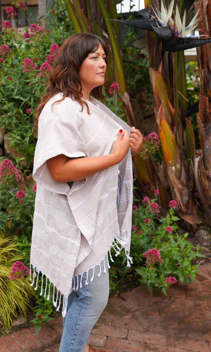 Woman in Tan stripe mid-length cover-up in outdoor setting