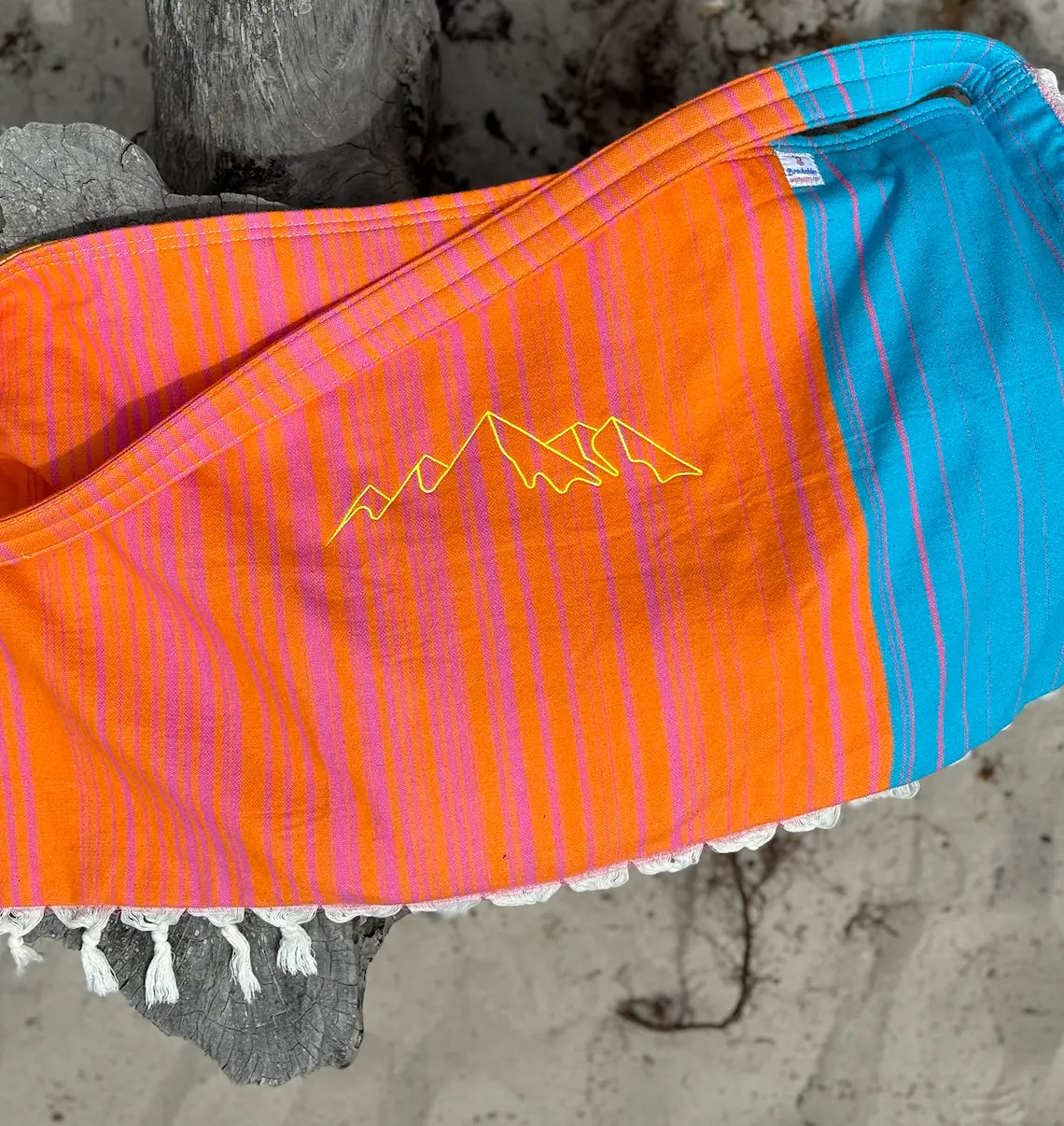 Orange and teal striped 3 in 1 beach bag with mountain scene embroidery design in yellow thread