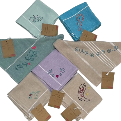 Set of embroidered bandanas with various designs on a white background