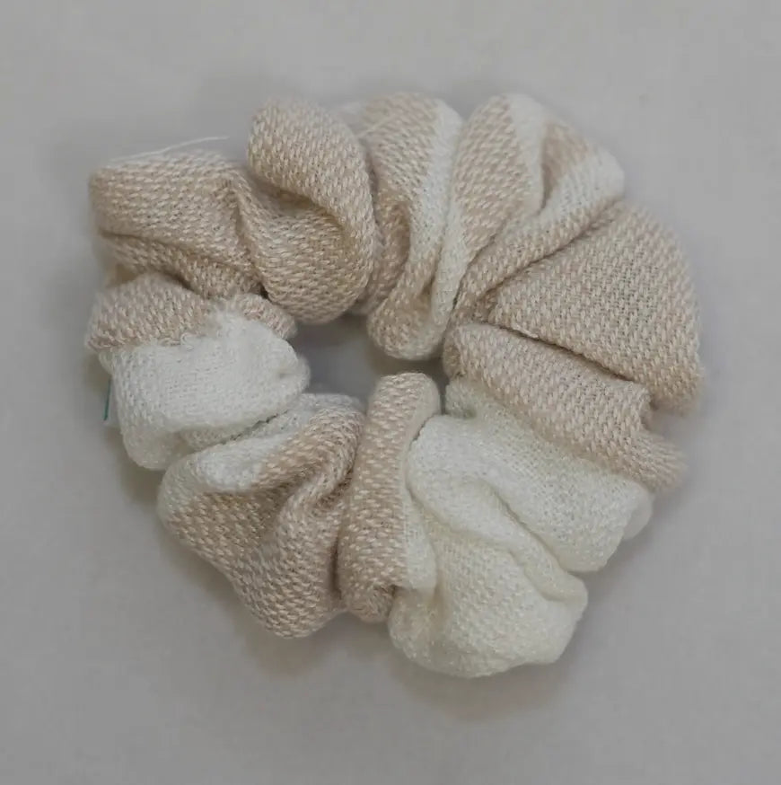 beige scrunchie on a light gray background
