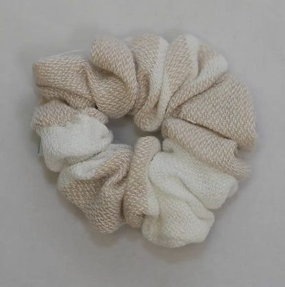 beige scrunchie on a light gray background